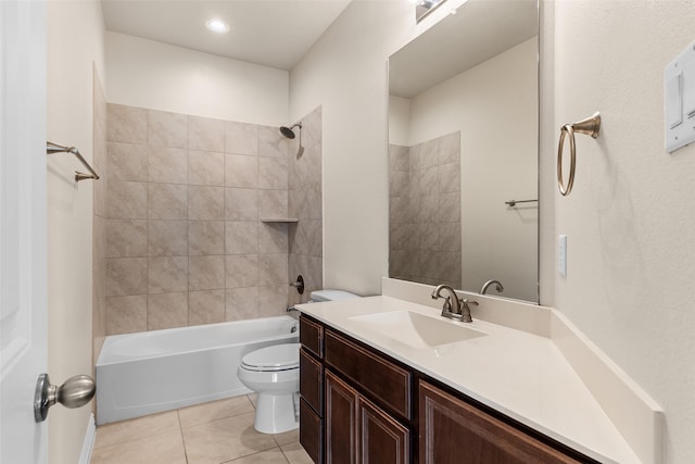 full bathroom featuring tile patterned floors, bathing tub / shower combination, toilet, and vanity