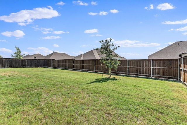 view of yard with a fenced backyard