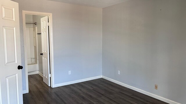 interior space with dark hardwood / wood-style flooring