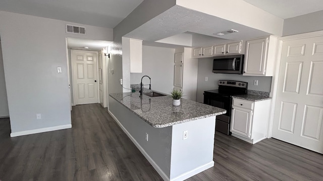 kitchen with kitchen peninsula, electric range oven, dark hardwood / wood-style flooring, and white cabinetry