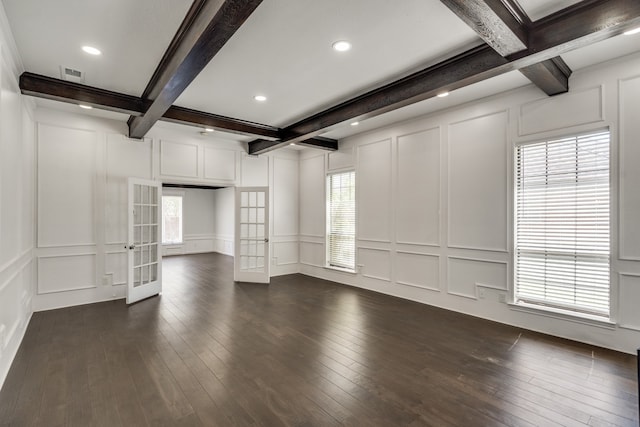 unfurnished living room with coffered ceiling, beam ceiling, dark hardwood / wood-style flooring, and french doors