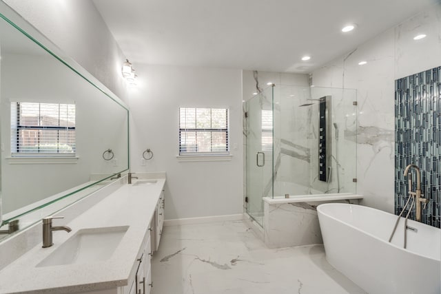 bathroom with vanity and independent shower and bath