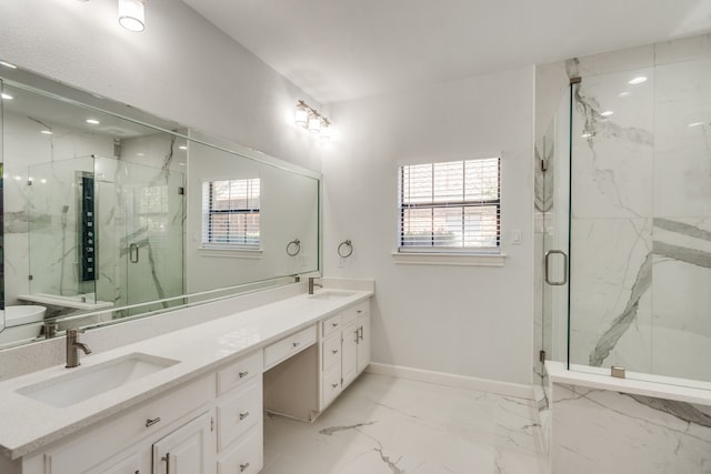 bathroom with vanity and a shower with shower door