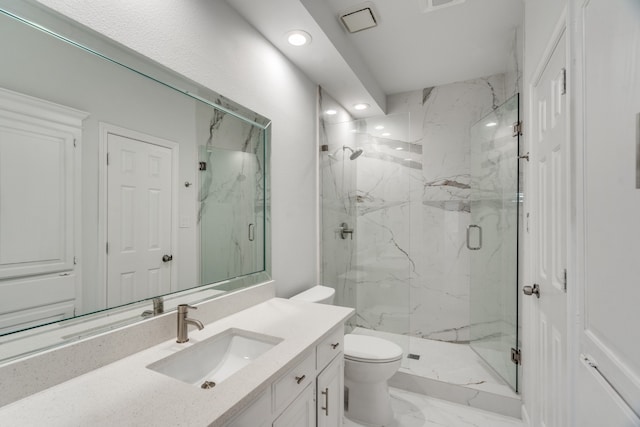 bathroom with vanity, toilet, and an enclosed shower