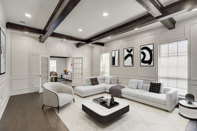 living room with french doors, coffered ceiling, hardwood / wood-style flooring, and beam ceiling