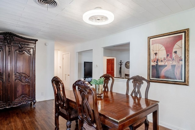 dining room with dark hardwood / wood-style floors