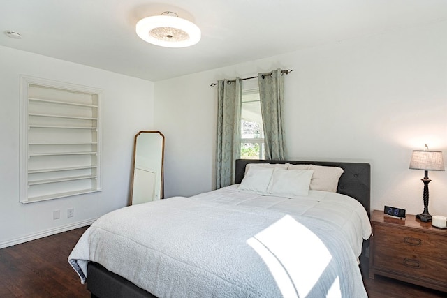 bedroom featuring dark hardwood / wood-style flooring