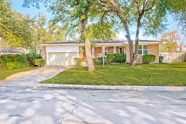 ranch-style house with a front yard and a garage