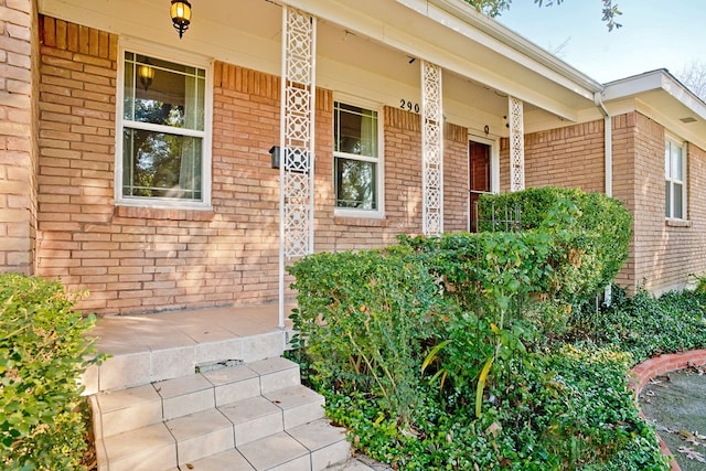 property entrance with covered porch