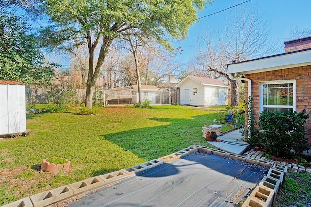 view of yard with a storage unit