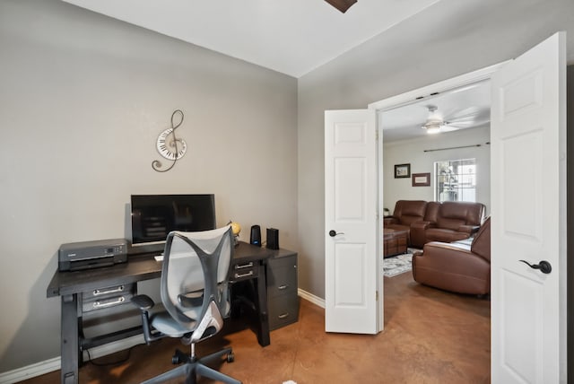 office featuring ceiling fan and vaulted ceiling