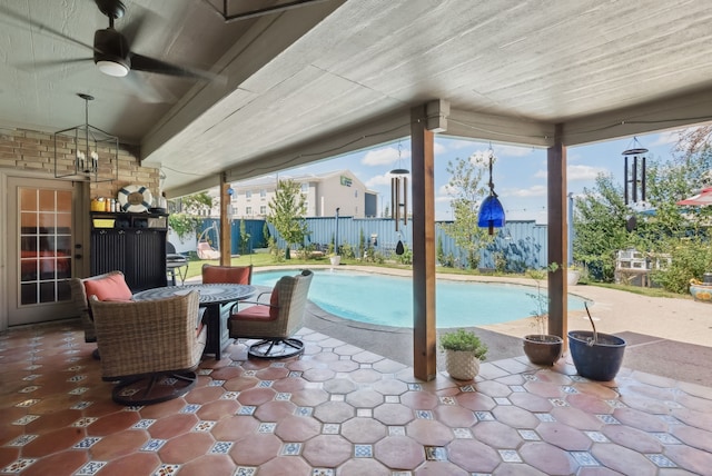 view of pool featuring a patio area and ceiling fan