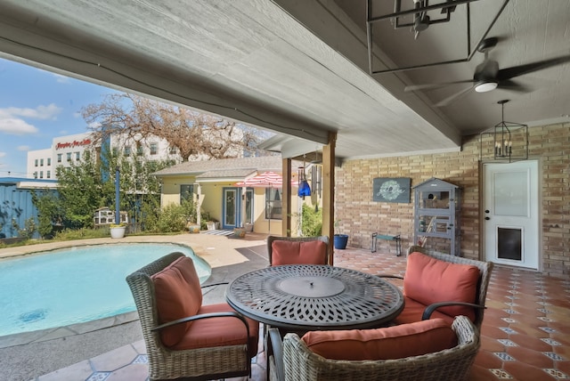 view of patio featuring ceiling fan