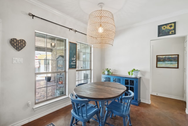 dining space featuring crown molding