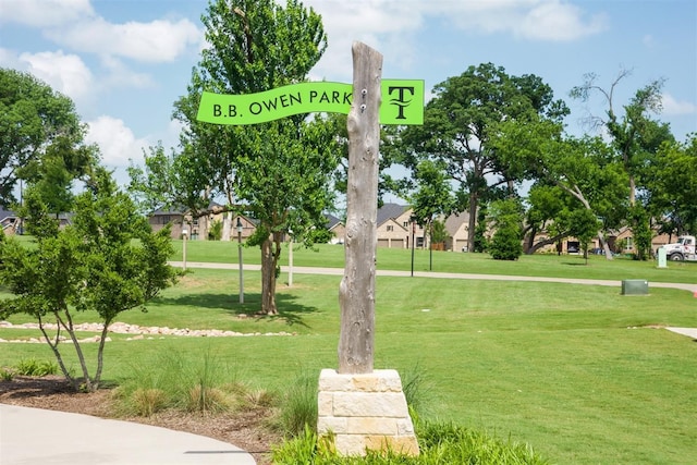 view of home's community with a lawn