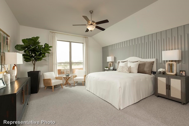 carpeted bedroom featuring vaulted ceiling and ceiling fan