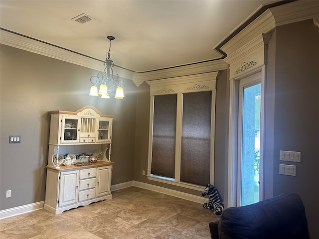 dining space with a notable chandelier, crown molding, and a healthy amount of sunlight