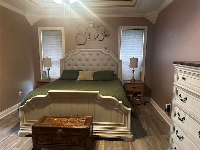 bedroom with ornamental molding and dark hardwood / wood-style floors