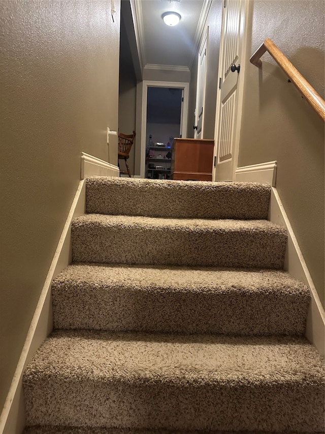 staircase with crown molding