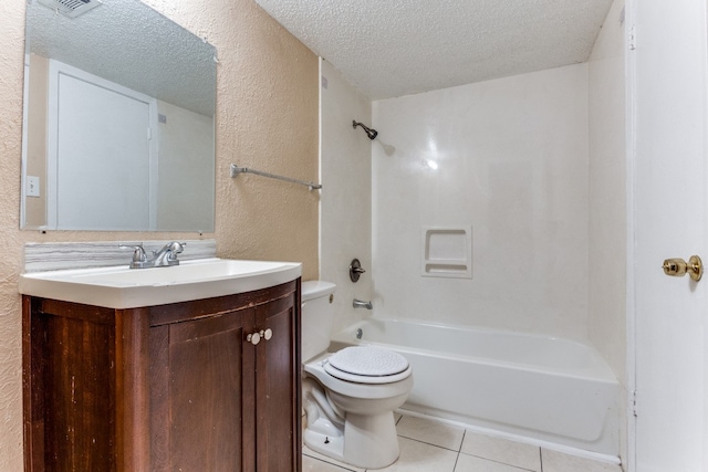 full bathroom featuring a textured ceiling, vanity, toilet, bathtub / shower combination, and tile patterned floors