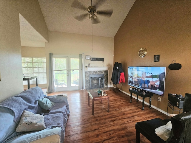 living room featuring ceiling fan, dark hardwood / wood-style floors, and high vaulted ceiling