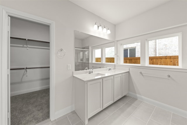 3504 Verbena Xing, Melissa, TX 75454 - bathroom with a stall shower, double vanity, a spacious closet, and baseboards