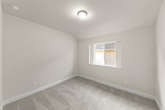 3504 Verbena Xing, Melissa, TX 75454 - spare room featuring carpet, lofted ceiling, baseboards, and a smoke detector