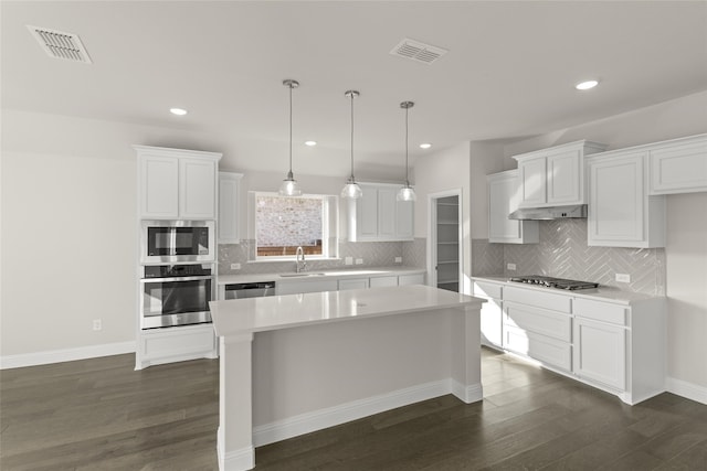 3504 Verbena Xing, Melissa, TX 75454 - kitchen with stainless steel appliances, dark wood-style floors, light countertops, white cabinetry, and a sink
