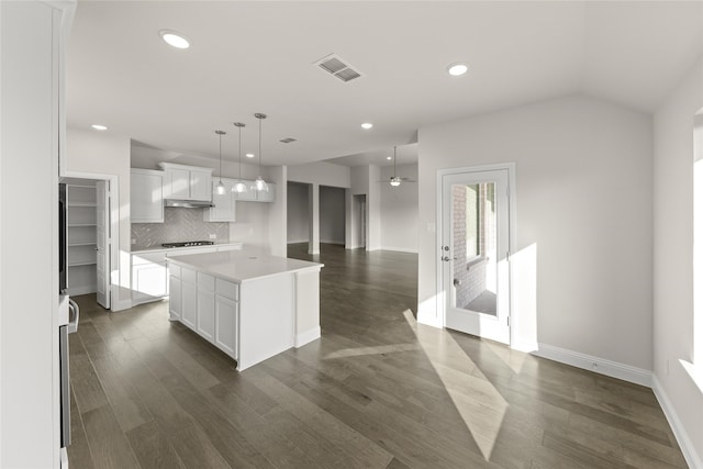 3504 Verbena Xing, Melissa, TX 75454 - kitchen featuring a kitchen island, backsplash, white cabinets, dark wood-type flooring, and stovetop