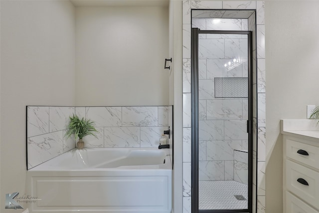 bathroom featuring separate shower and tub and vanity