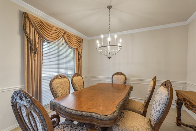 carpeted dining space with ornamental molding and a chandelier