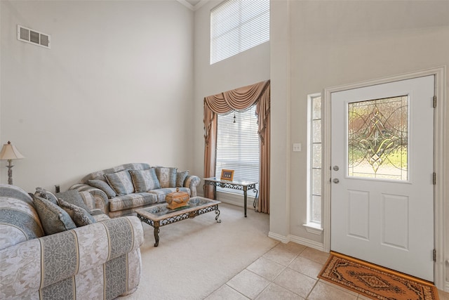 entrance foyer featuring light carpet