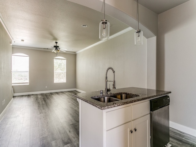 kitchen featuring dishwasher, dark hardwood / wood-style floors, hanging light fixtures, and white cabinets