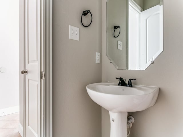 bathroom with sink and tile patterned floors