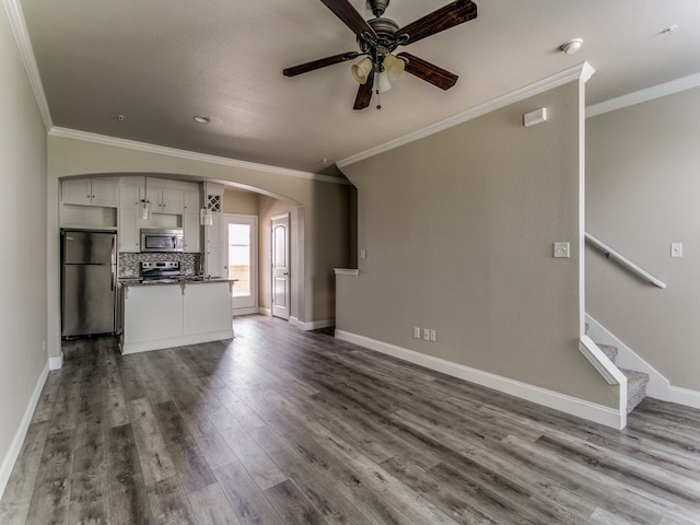 unfurnished living room featuring crown molding, ceiling fan, and hardwood / wood-style flooring