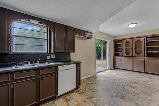 kitchen with dishwasher, a textured ceiling, sink, and dark brown cabinetry