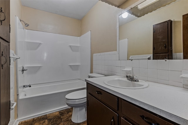 full bathroom with toilet, vanity, decorative backsplash, tile walls, and washtub / shower combination