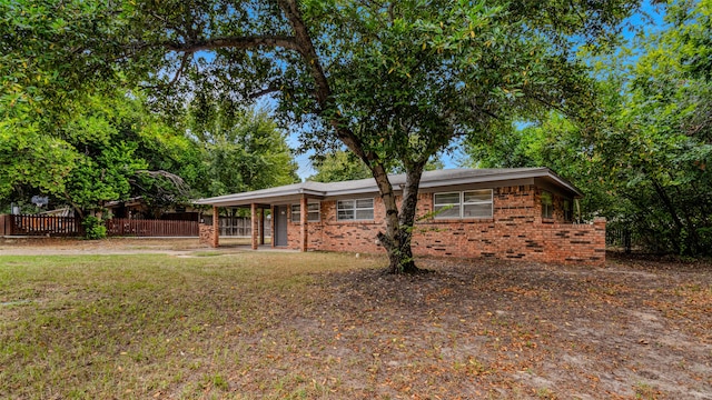 view of front of home with a front lawn