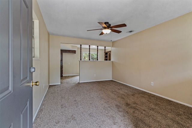 unfurnished room with ceiling fan and carpet floors