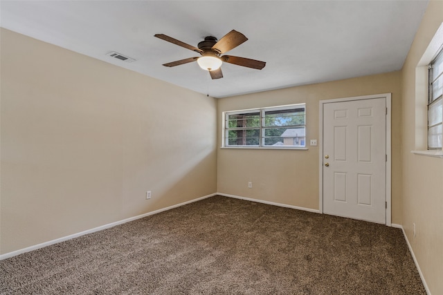 spare room with ceiling fan and carpet floors