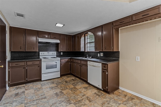 kitchen featuring a textured ceiling, sink, dark brown cabinetry, and white appliances