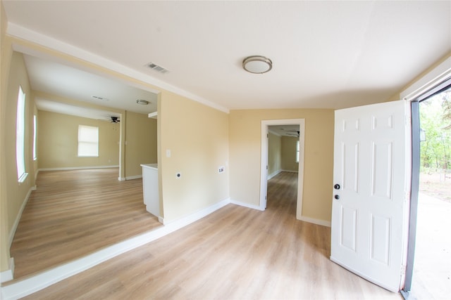 spare room with ceiling fan and light hardwood / wood-style flooring