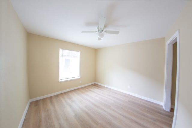 empty room featuring ceiling fan and light hardwood / wood-style flooring