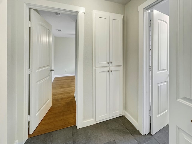 hallway featuring dark wood-type flooring