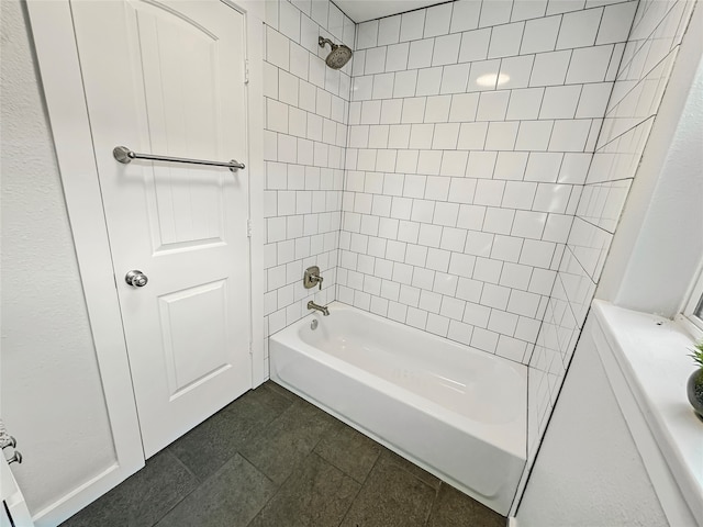 bathroom with vanity and tiled shower / bath