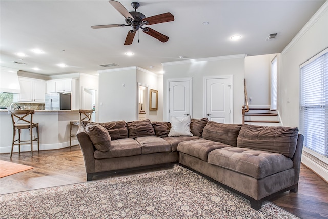 living room with ceiling fan, hardwood / wood-style flooring, and a wealth of natural light