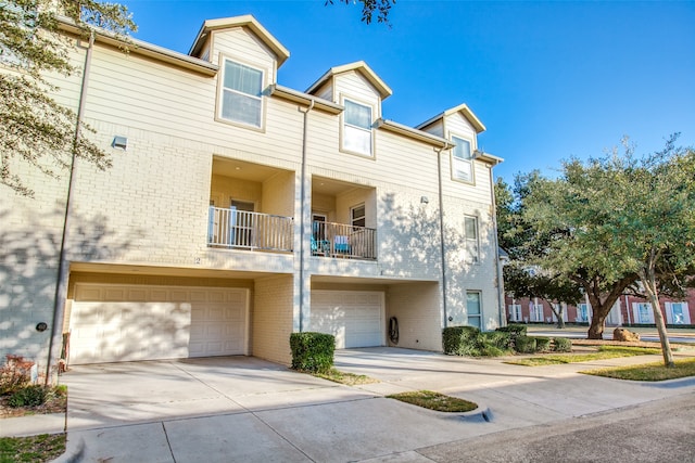 exterior space with a balcony and a garage