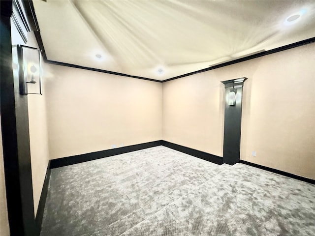 empty room with carpet and ornamental molding