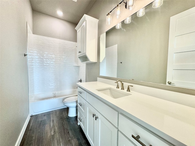 full bathroom featuring hardwood / wood-style floors, toilet, bathtub / shower combination, and vanity