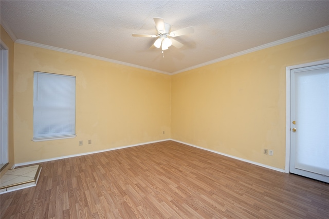 empty room with ceiling fan, hardwood / wood-style flooring, crown molding, and a textured ceiling